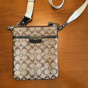 Coach crossbody bag, tan/brown with black leather trim.